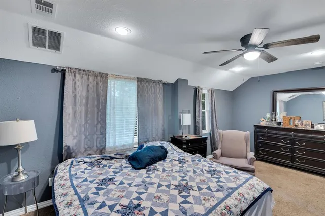 a view of a livingroom with a ceiling fan