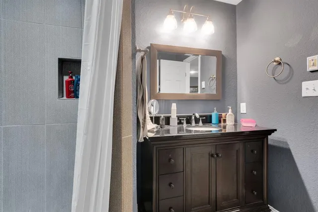 a bathroom with a shower and a toilet