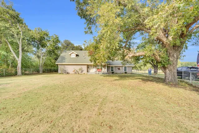 a view of swimming pool with trees in the background