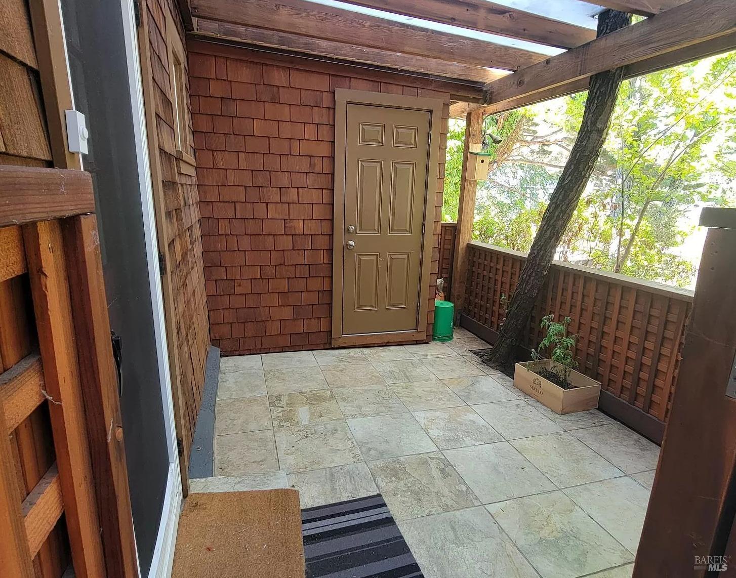 271 Corte Madera Avenue, Unit 1 Corte Madera, CA 94925 - Photo 1 of 1 a view of porch with furniture and a shower