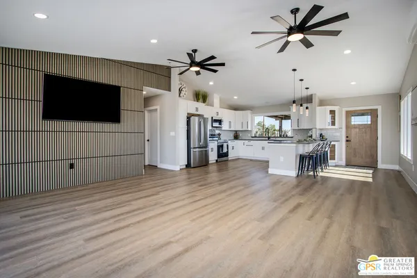 a kitchen with cabinets and appliances