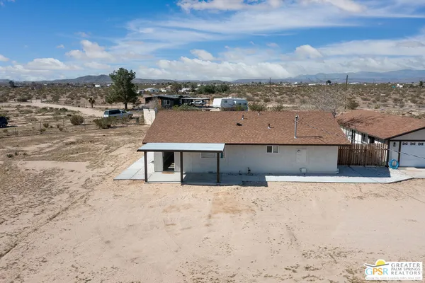 an aerial view of residential houses with a outdoor space