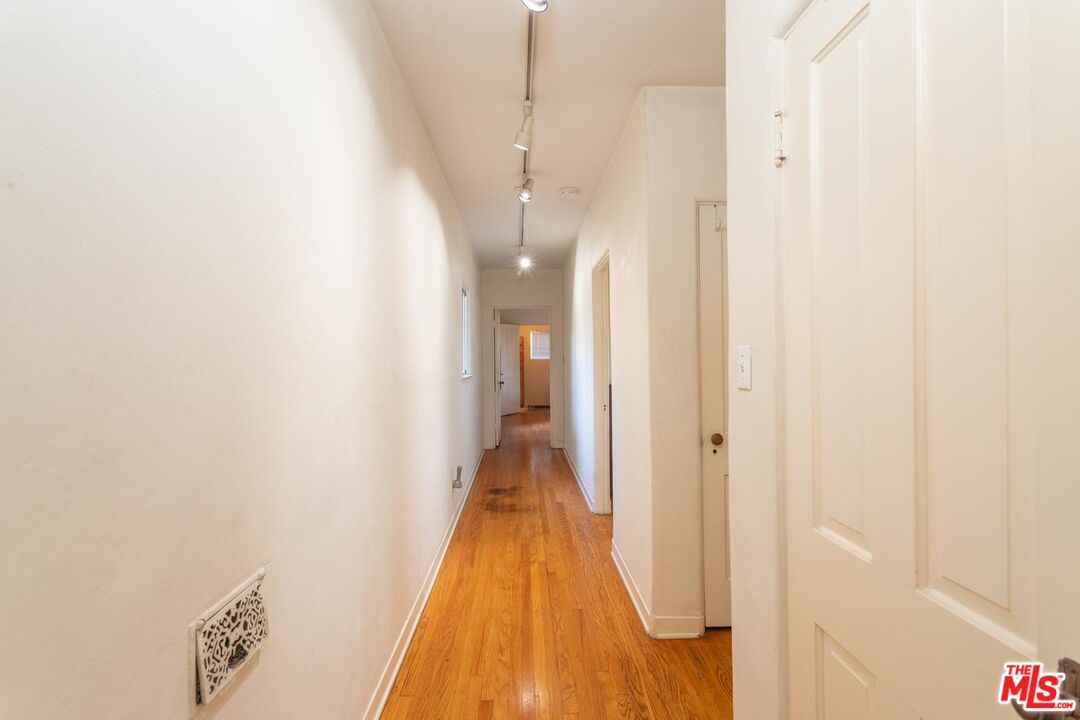 3936 Roderick Road Los Angeles, CA 90065 - Photo 16 of 36 a view of a hallway with wooden floor