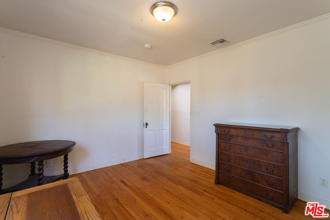 3936 Roderick Road Los Angeles, CA 90065 - Photo 19 of 36 a view of room with wooden floor and chair
