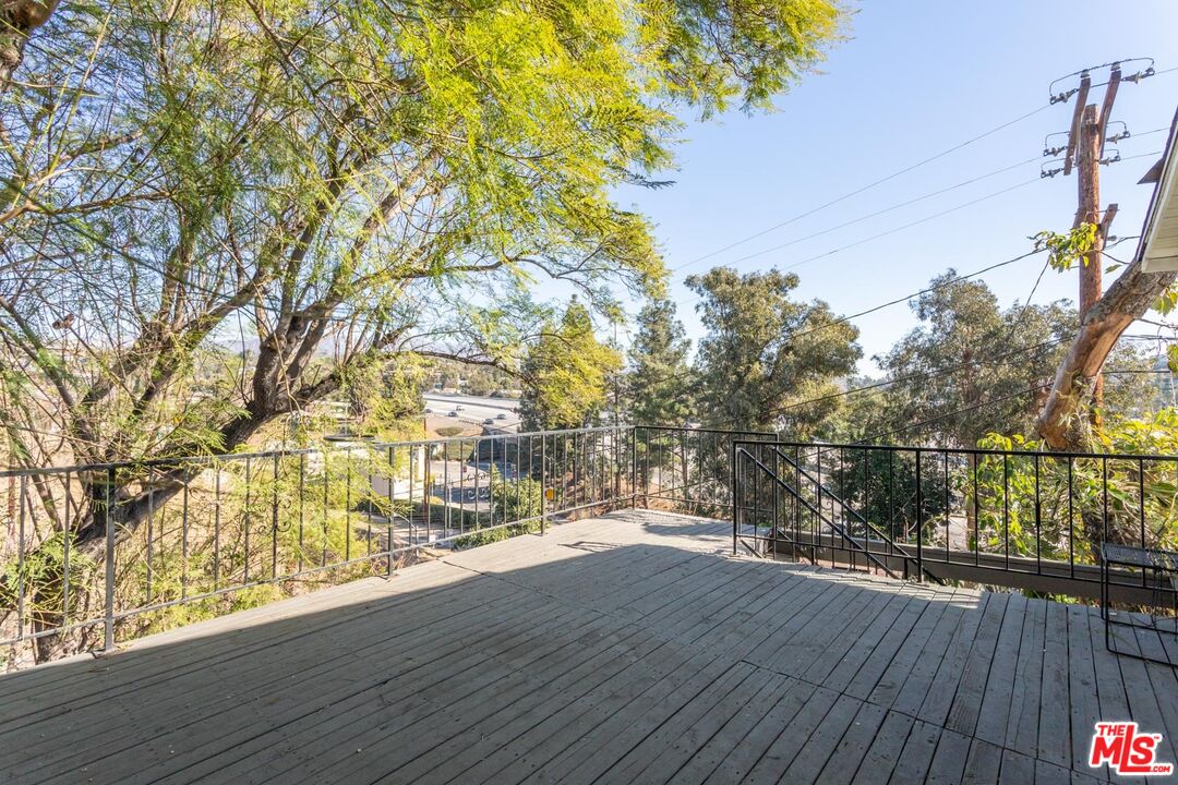 3936 Roderick Road Los Angeles, CA 90065 - Photo 21 of 36 a view of a balcony with wooden floor and plants