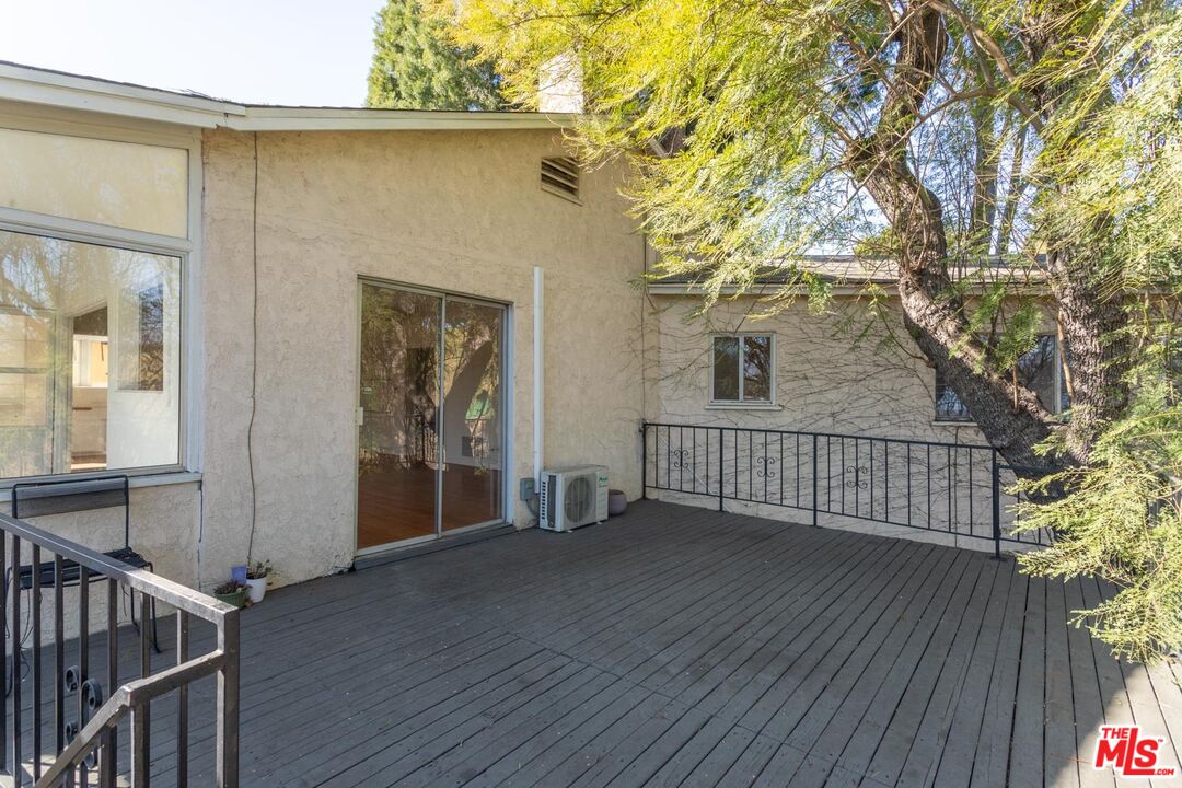 3936 Roderick Road Los Angeles, CA 90065 - Photo 22 of 36 a view of backyard with a deck and wooden floor
