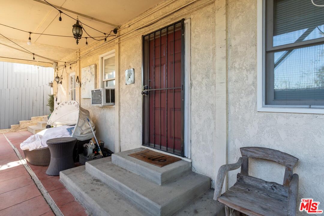 3936 Roderick Road Los Angeles, CA 90065 - Photo 24 of 36 a bedroom with a bed and wooden floor