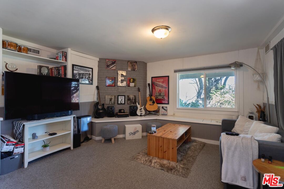 3936 Roderick Road Los Angeles, CA 90065 - Photo 26 of 36 a living room with furniture and a flat screen tv