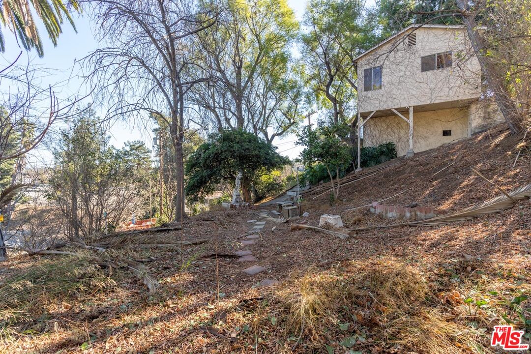 3936 Roderick Road Los Angeles, CA 90065 - Photo 29 of 36 a view of a house with a yard