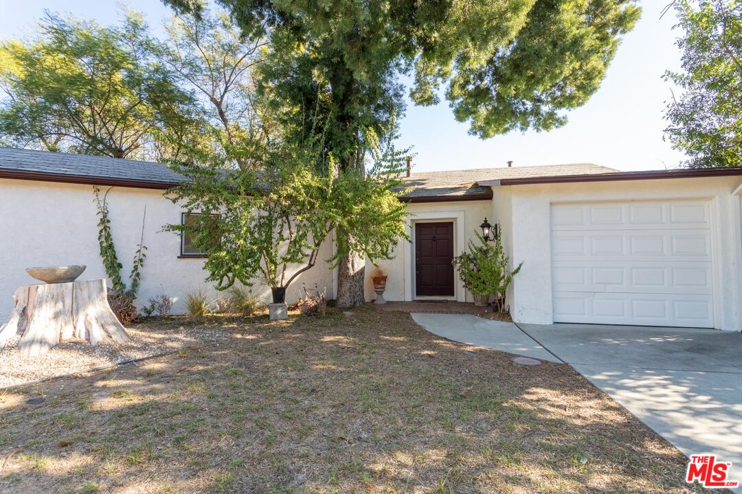 3936 Roderick Road Los Angeles, CA 90065 - Photo 33 of 36 a view of a house with a yard and garage