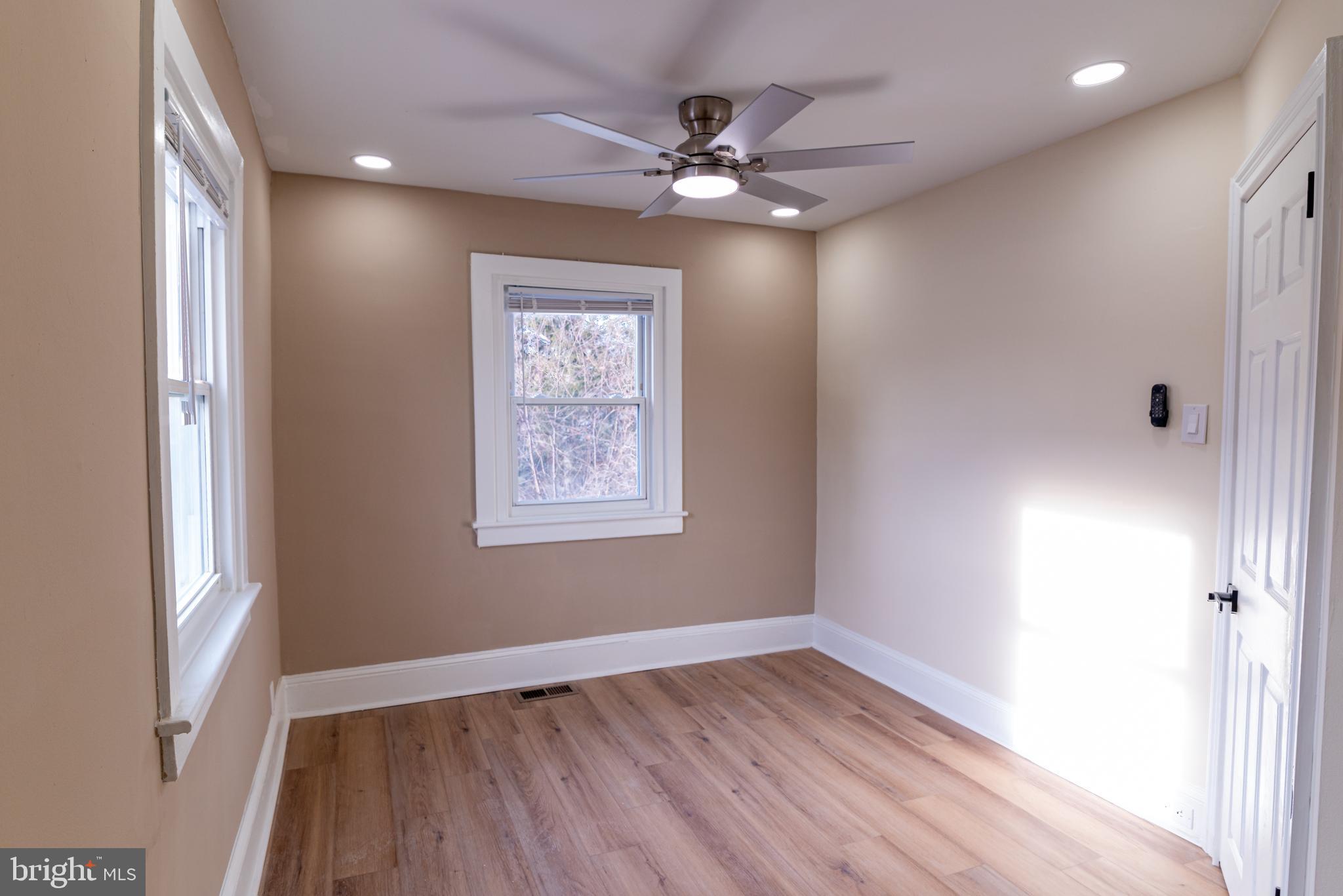 8030 Ferndale Street Philadelphia, PA 19111 - Photo 17 of 36 an empty room with wooden floor closet and fan