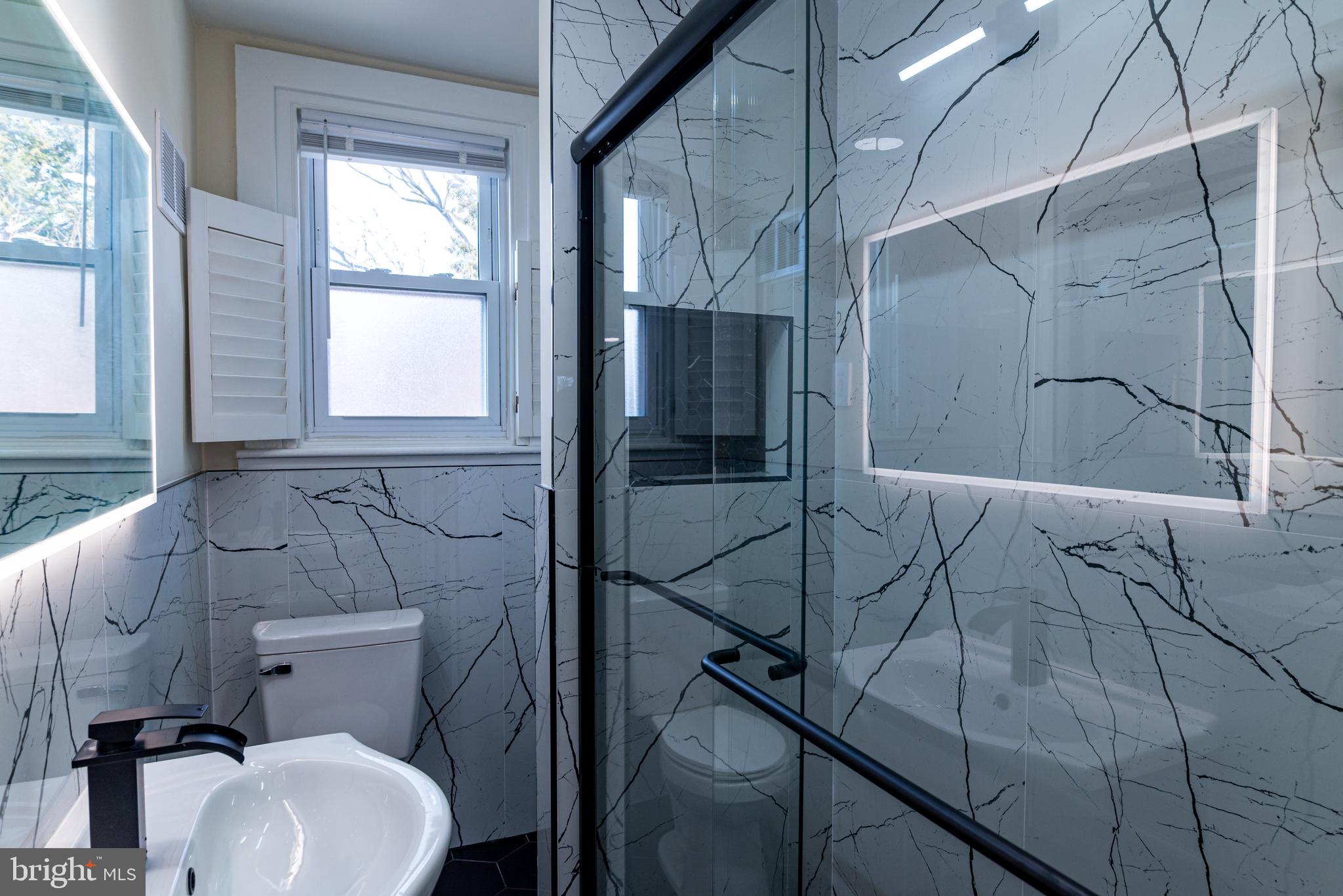 8030 Ferndale Street Philadelphia, PA 19111 - Photo 18 of 36 a bathroom with a toilet and a shower