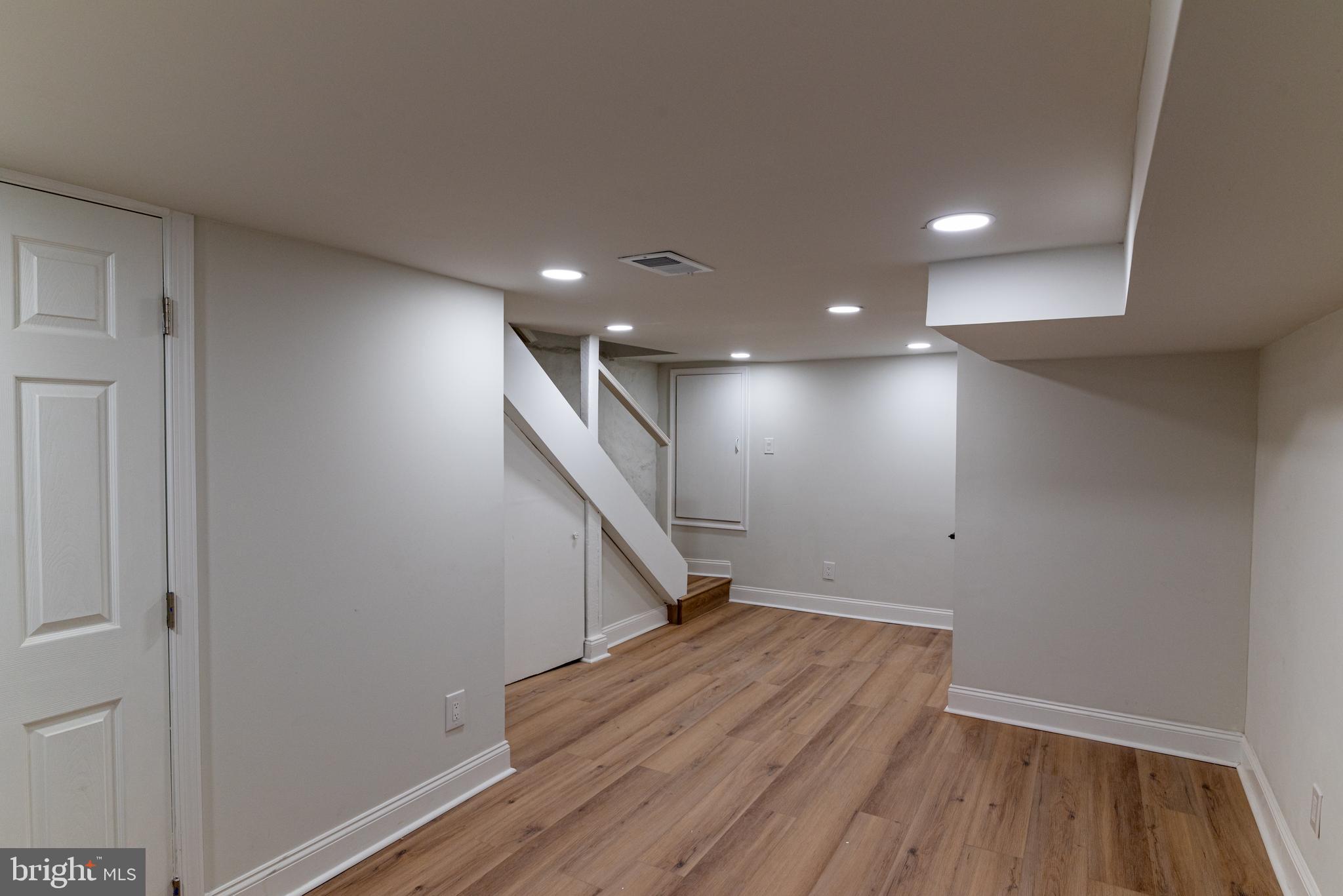 8030 Ferndale Street Philadelphia, PA 19111 - Photo 20 of 36 a view of hallway with stairs and wooden floor