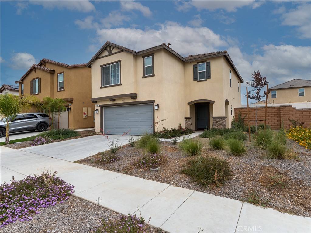 25602 Pne Rdg Road Homeland, CA 92548 - Photo 2 of 35 a front view of a house with a yard and garage
