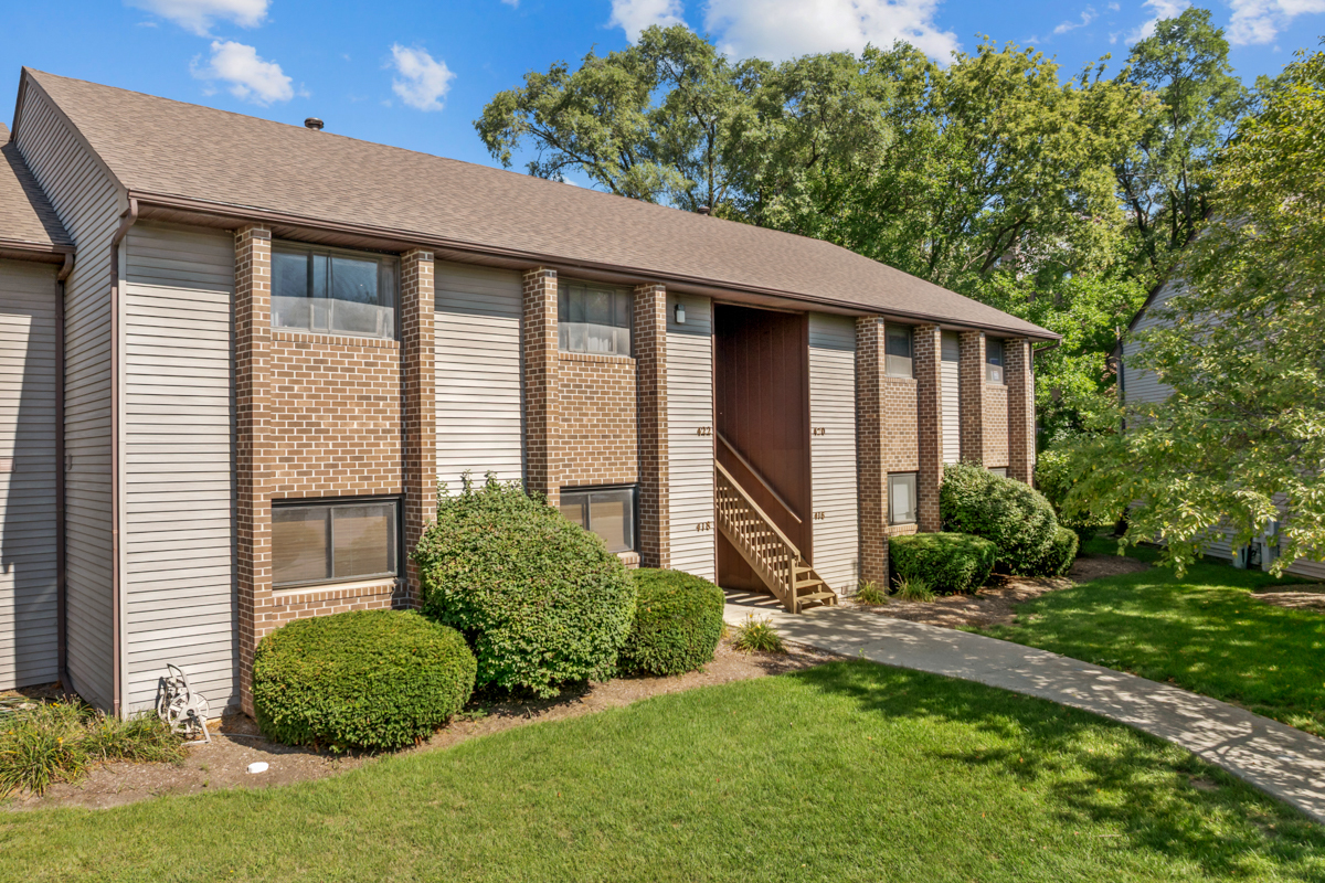 418 Heine Avenue, Unit 418 Elgin, IL 60123 - Photo 1 of 1 a front view of a house with a yard