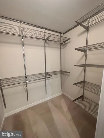 a view of an empty walk in closet