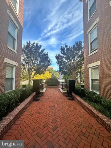 a backyard of a house with yard and outdoor seating
