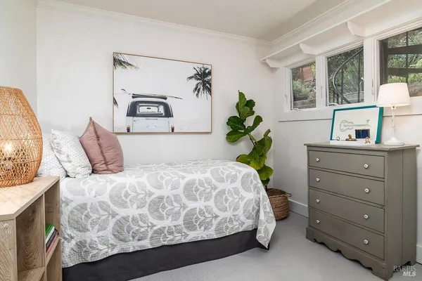 a bedroom with a bed and a table in it