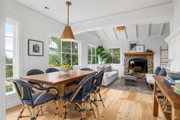 a dining room with furniture window and outside view