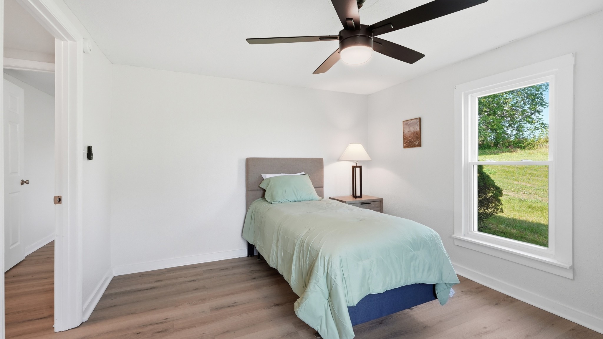 469 Fred Cooper Road McMinnville, TN 37110 - Photo 24 of 46 a bedroom with a bed and a window