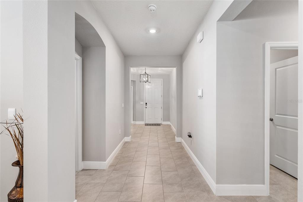 5912 Southwest 46th Drive Gainesville, FL 32608 - Photo 11 of 74 a view of a hallway with wooden floor and closet