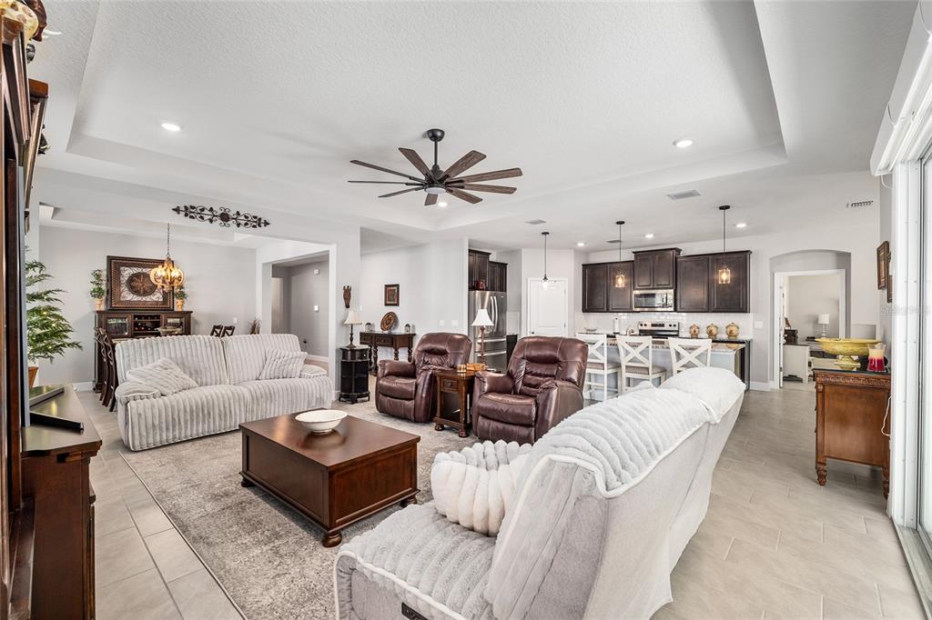5912 Southwest 46th Drive Gainesville, FL 32608 - Photo 16 of 74 a living room with furniture kitchen view and a window
