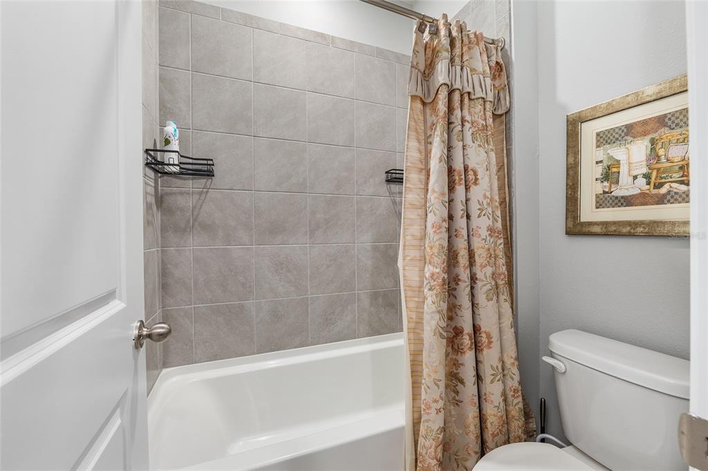 5912 Southwest 46th Drive Gainesville, FL 32608 - Photo 48 of 74 a bathroom with a toilet and a shower