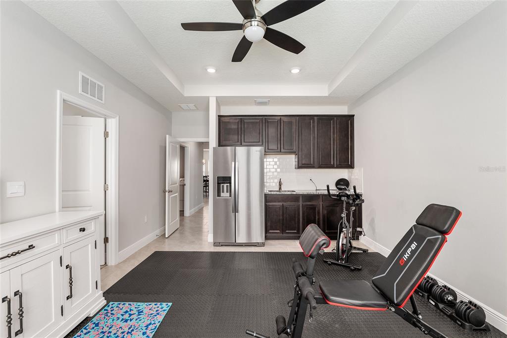 5912 Southwest 46th Drive Gainesville, FL 32608 - Photo 54 of 74 a view of a workspace with furniture and a window