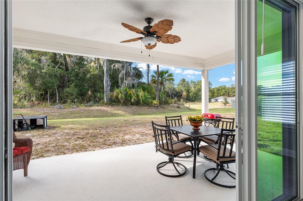 5912 Southwest 46th Drive Gainesville, FL 32608 - Photo 61 of 74 a view of a porch with furniture and a yard