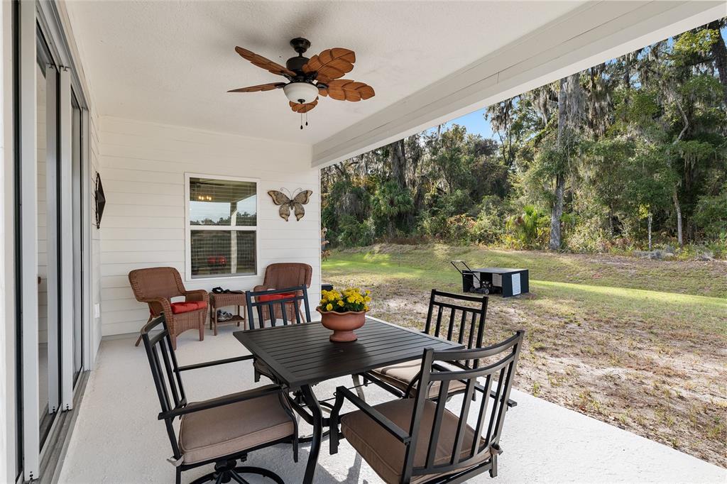 5912 Southwest 46th Drive Gainesville, FL 32608 - Photo 65 of 74 a view of a dining room with furniture window and outside view