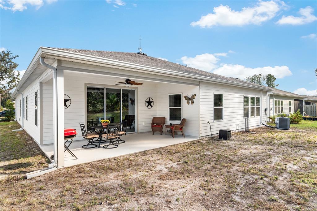 5912 Southwest 46th Drive Gainesville, FL 32608 - Photo 66 of 74 a view of a house with backyard and sitting area