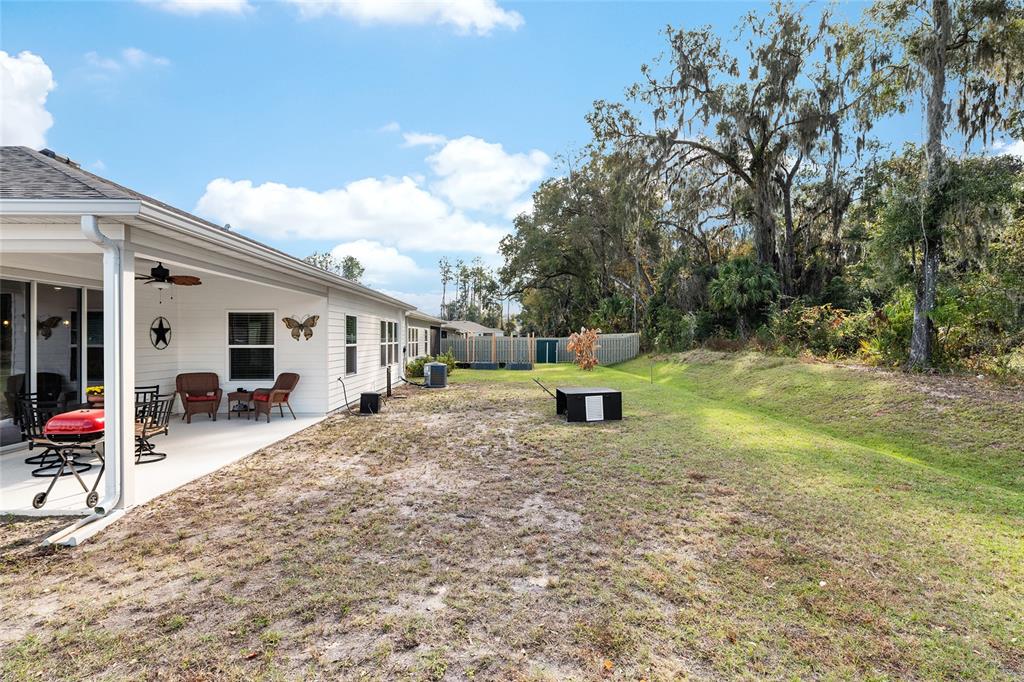 5912 Southwest 46th Drive Gainesville, FL 32608 - Photo 67 of 74 a view of a house with backyard and sitting area