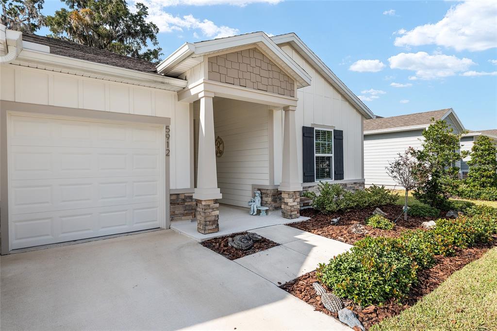 5912 Southwest 46th Drive Gainesville, FL 32608 - Photo 7 of 74 a front view of a house with a yard