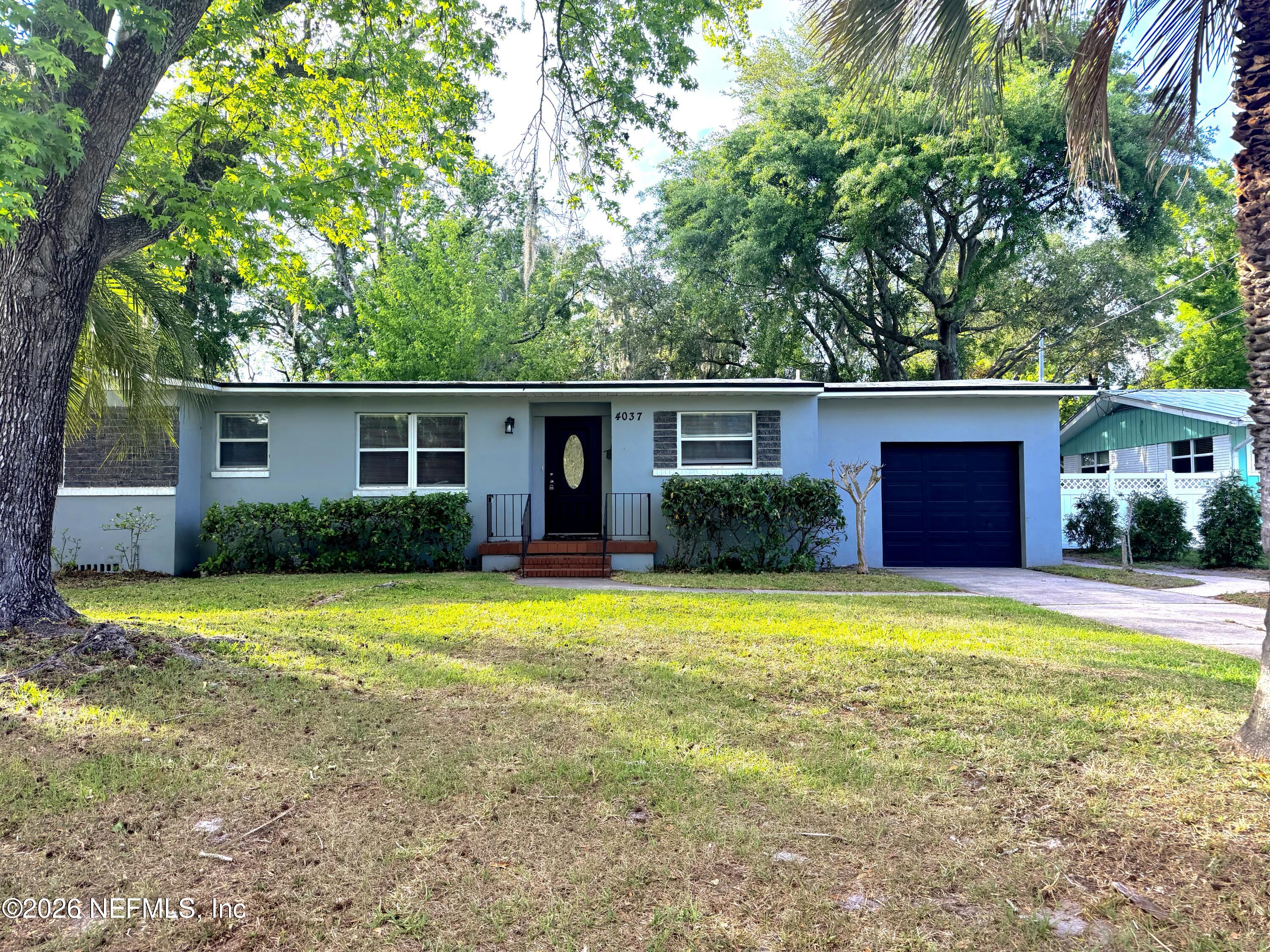 4037 Conga Street Jacksonville, FL 32217 - Photo 1 of 26 a front view of house with yard and trees