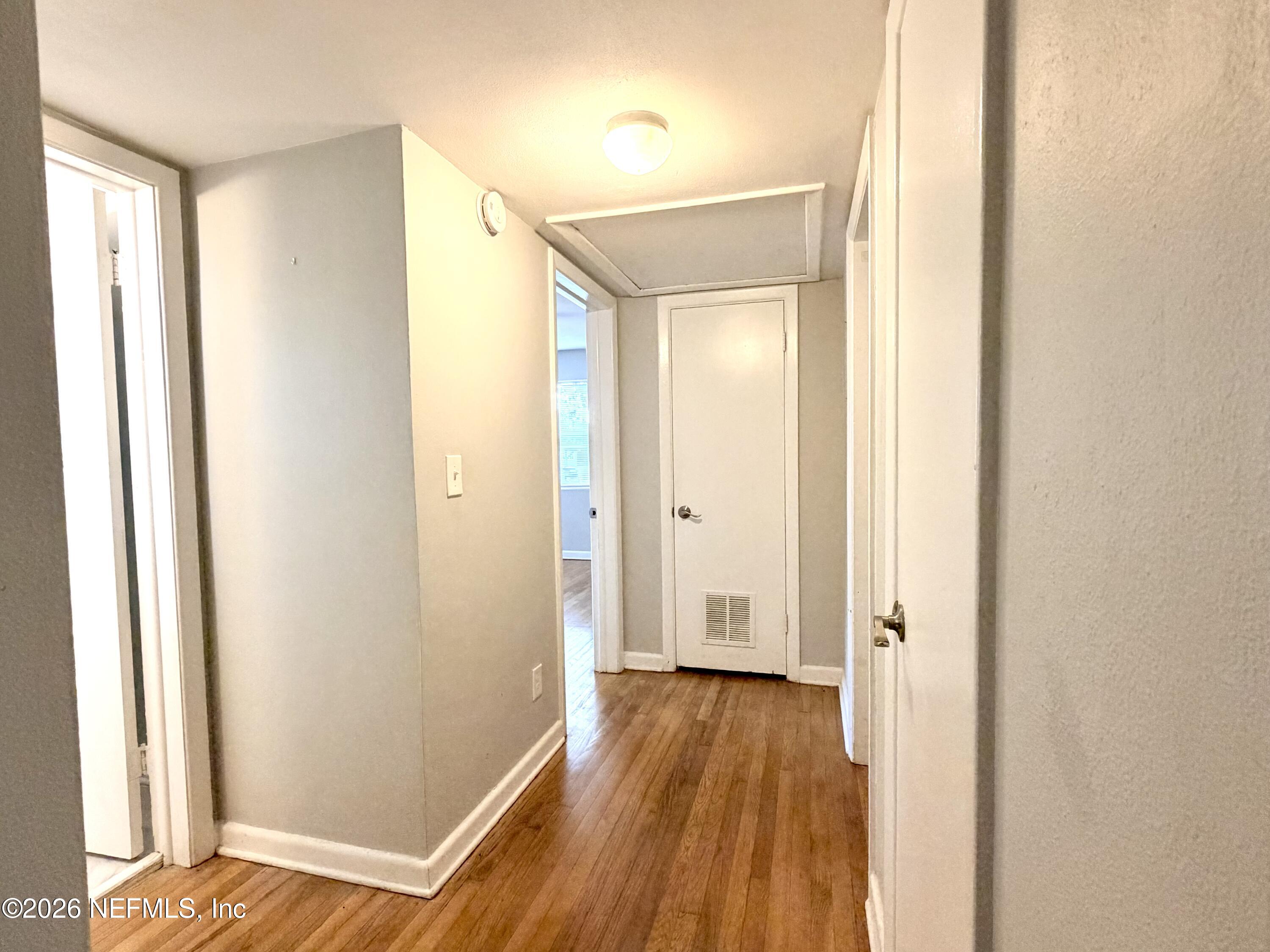 4037 Conga Street Jacksonville, FL 32217 - Photo 14 of 26 a view of a hallway with wooden floor