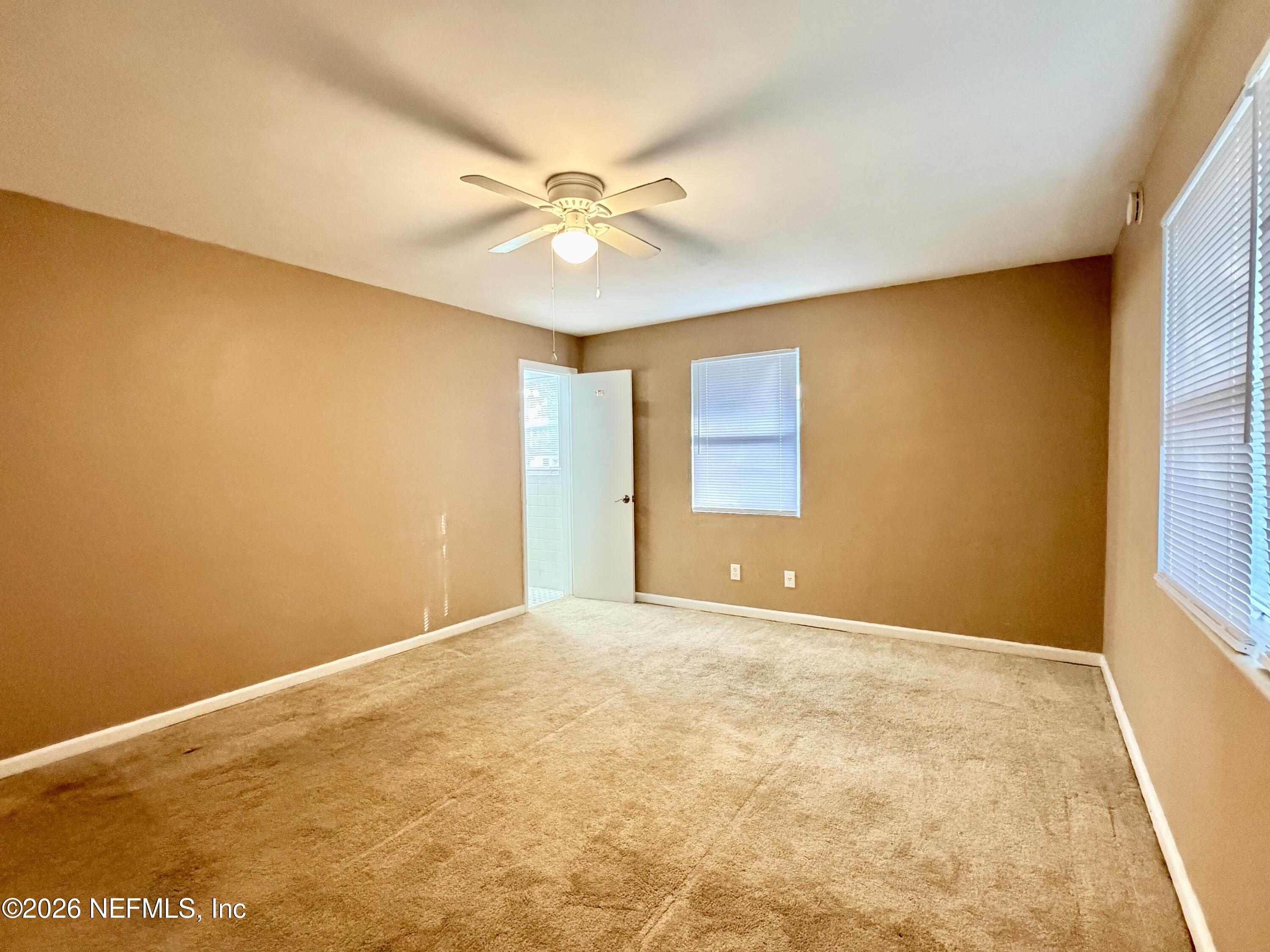 4037 Conga Street Jacksonville, FL 32217 - Photo 19 of 26 a view of an empty room with a window