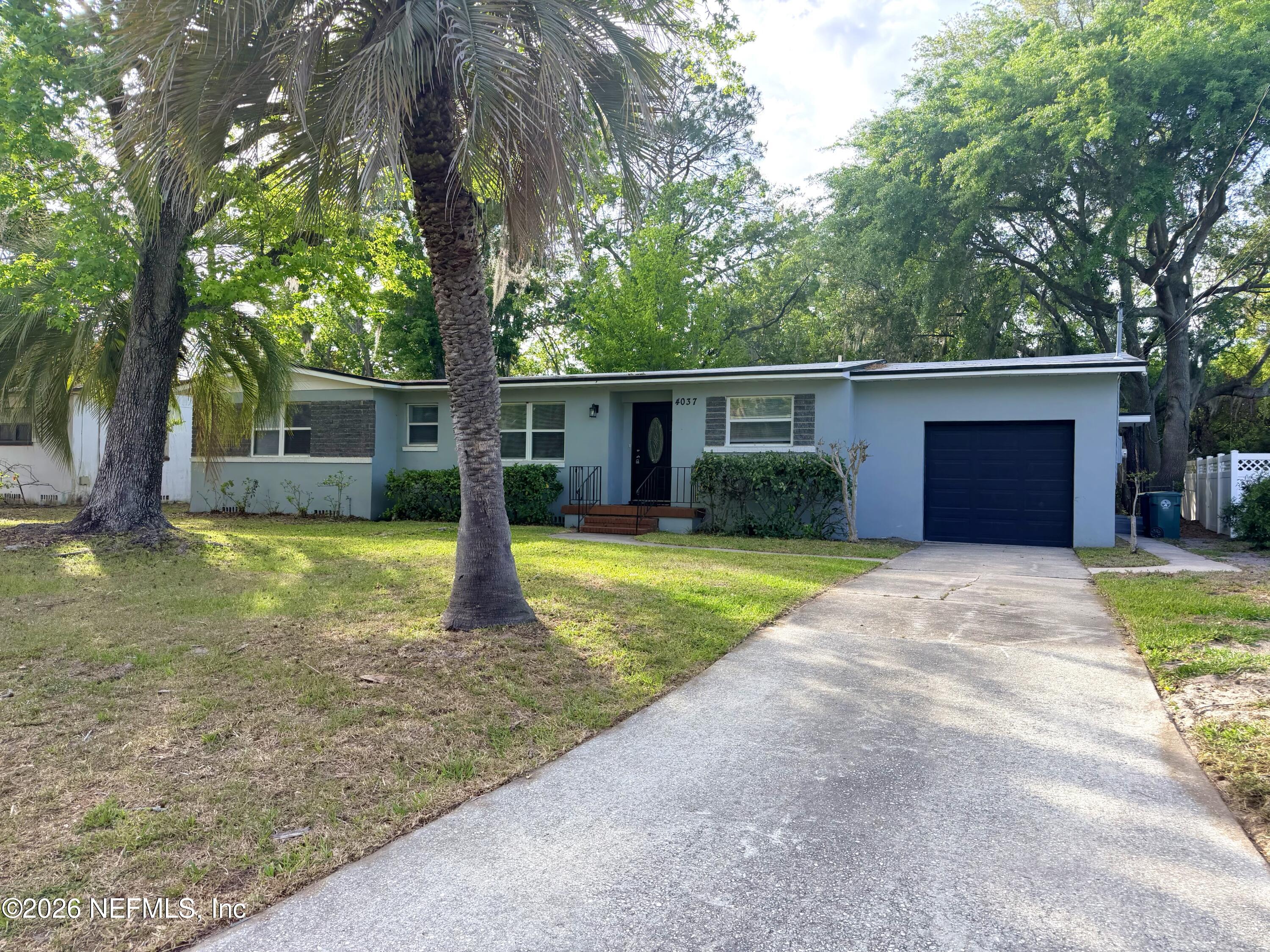 4037 Conga Street Jacksonville, FL 32217 - Photo 2 of 26 a front view of a house with garden