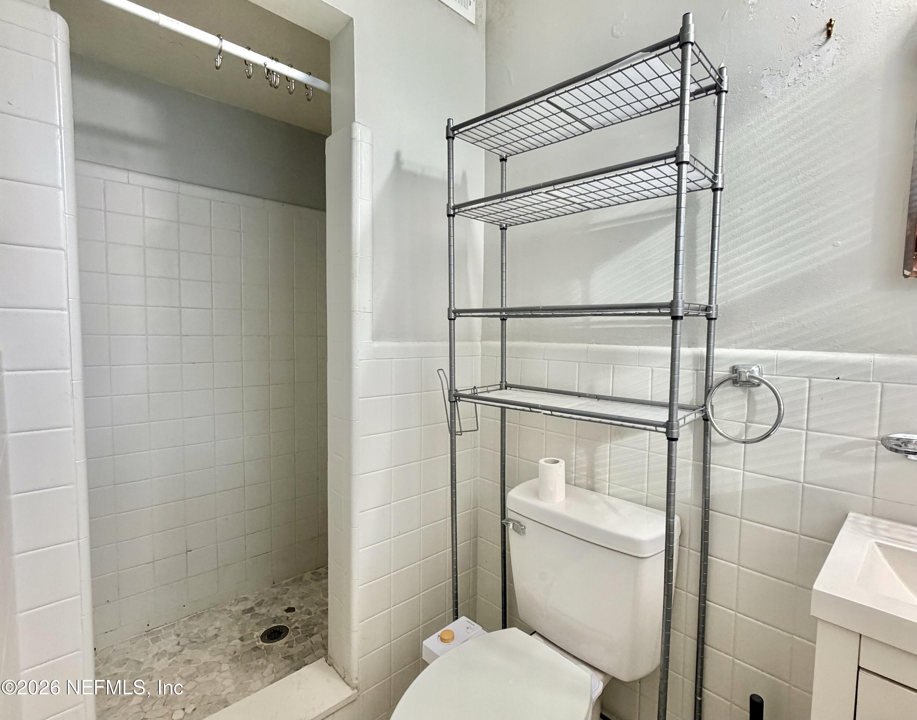 4037 Conga Street Jacksonville, FL 32217 - Photo 21 of 26 a bathroom with a toilet and a shower