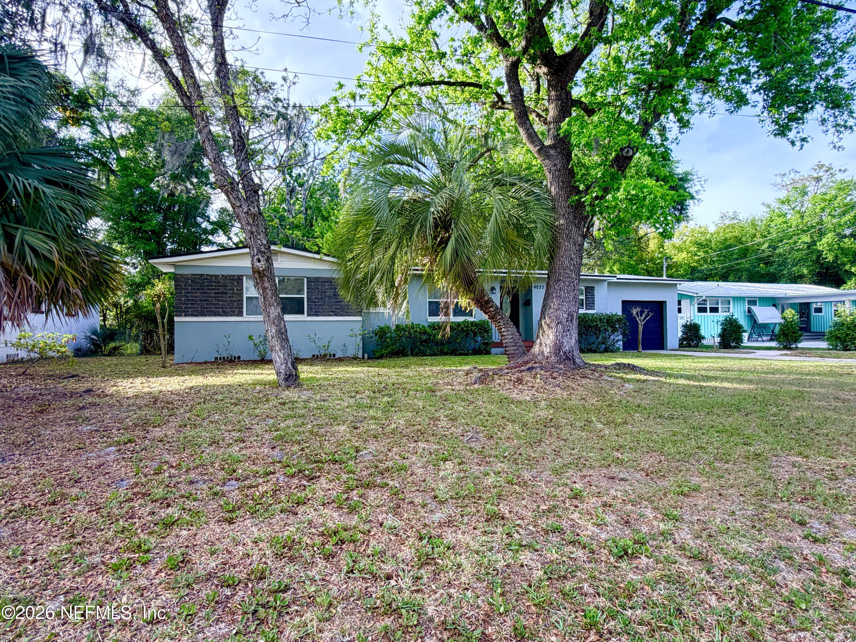4037 Conga Street Jacksonville, FL 32217 - Photo 3 of 26 front view of a house with a yard