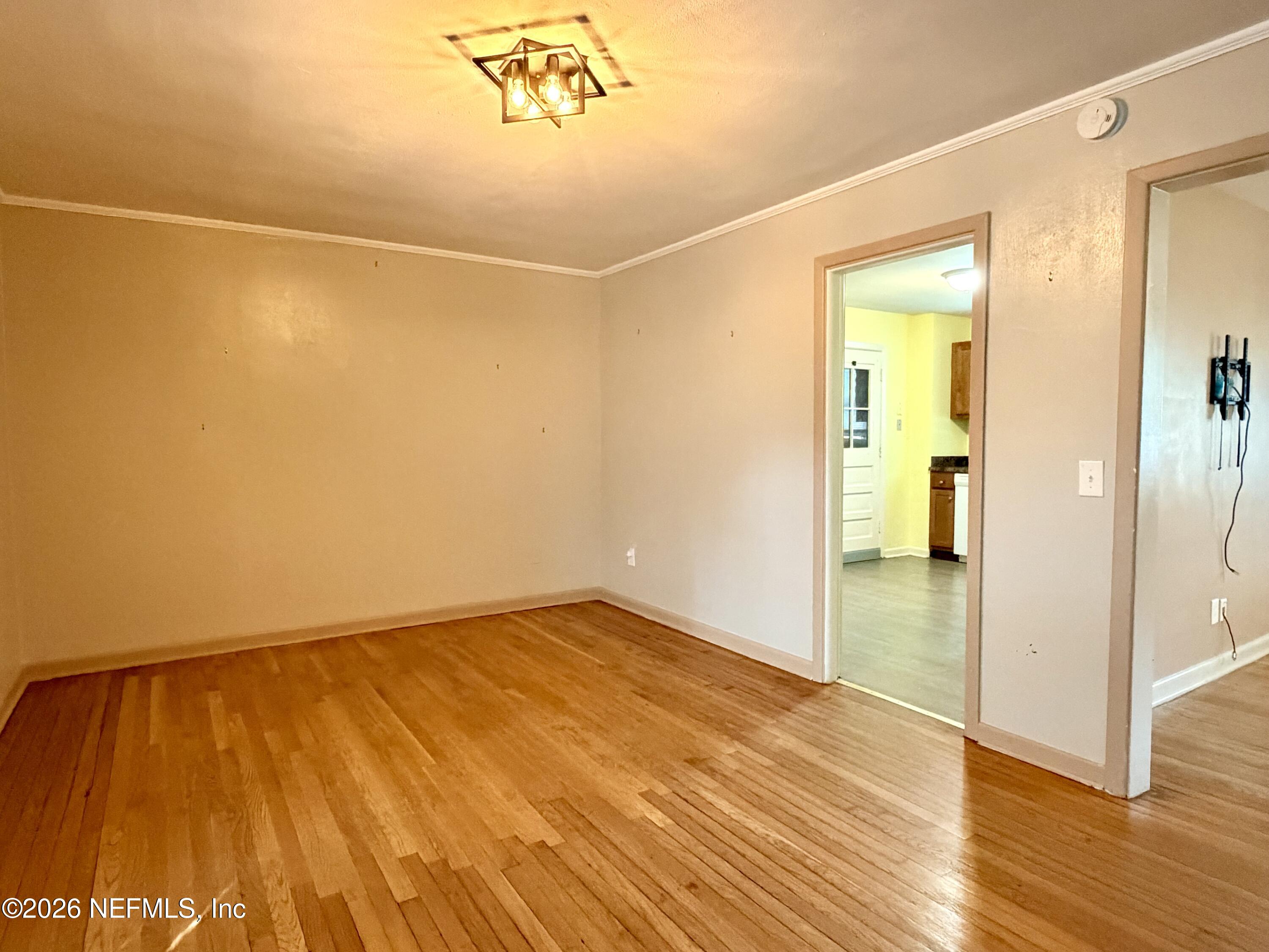 4037 Conga Street Jacksonville, FL 32217 - Photo 8 of 26 a view of an empty room with wooden floor