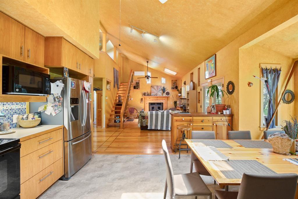 5803 Rittenhouse Shore Drive Austin, TX 78734 - Photo 14 of 35 a kitchen with stainless steel appliances kitchen island granite countertop a refrigerator and stove