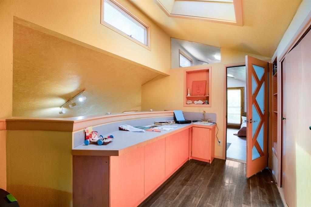 5803 Rittenhouse Shore Drive Austin, TX 78734 - Photo 17 of 35 a very nice looking room with wooden floor and furniture