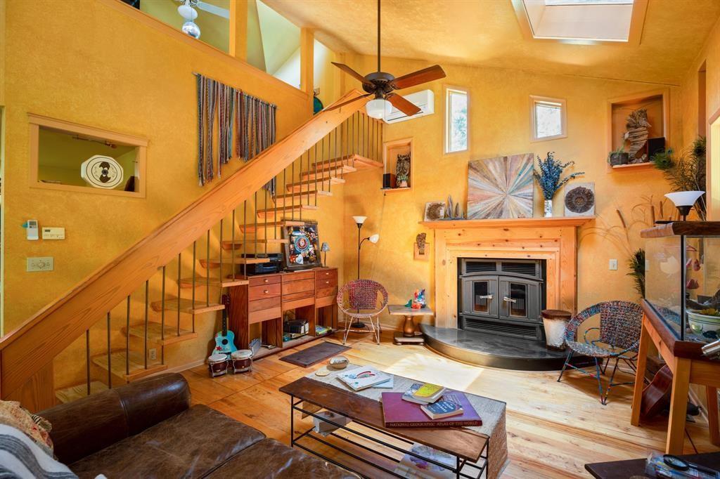 5803 Rittenhouse Shore Drive Austin, TX 78734 - Photo 18 of 35 a living room with furniture and a fireplace