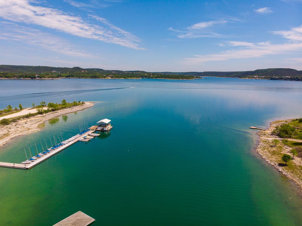 5803 Rittenhouse Shore Drive Austin, TX 78734 - Photo 2 of 35 a view of a lake with houses in the back