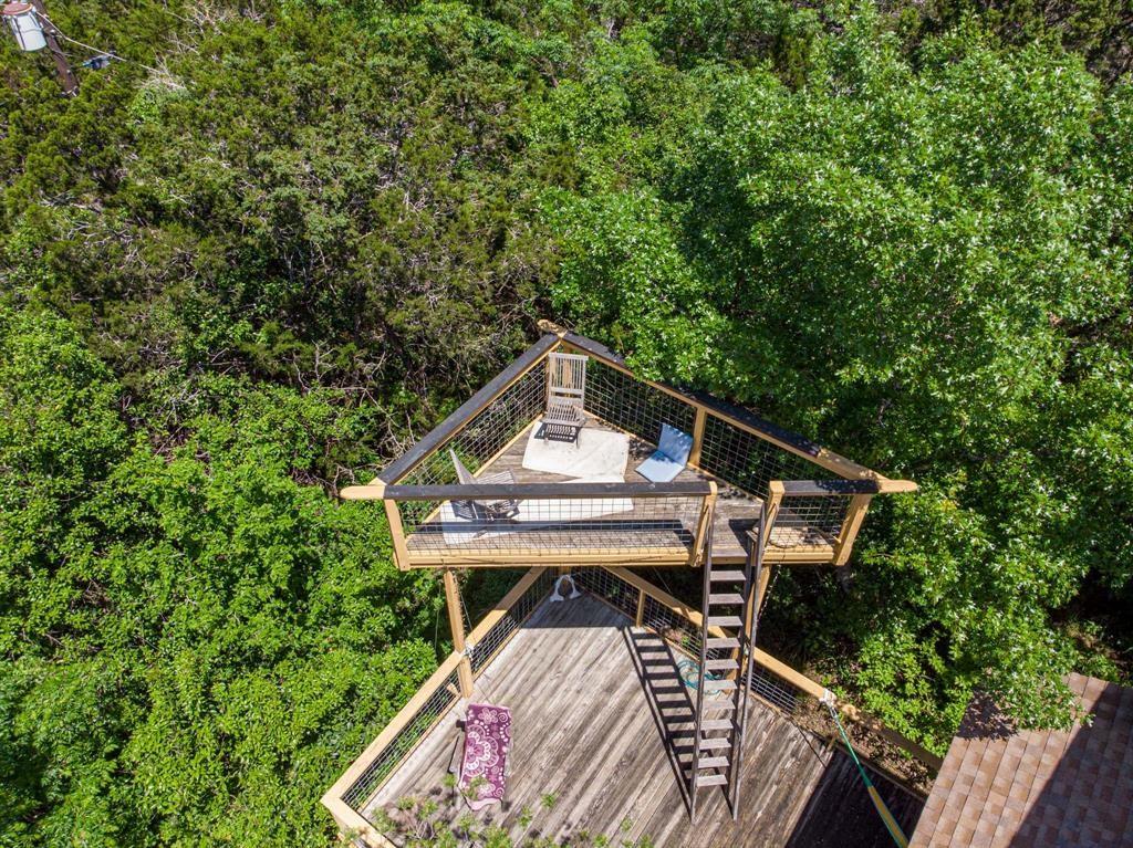 5803 Rittenhouse Shore Drive Austin, TX 78734 - Photo 22 of 35 a view of a roof deck with chair and wooden floor