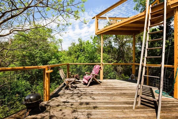 a view of a patio with wooden floor