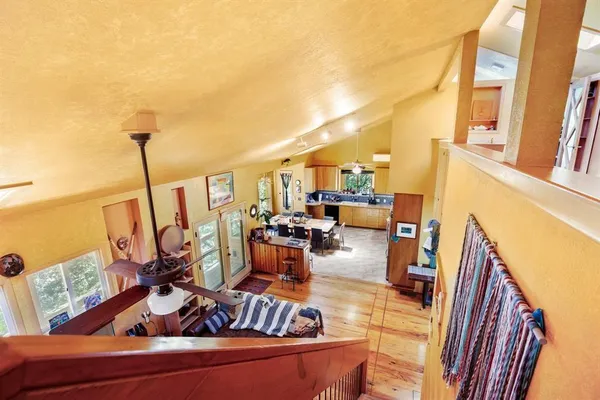 a view of living room with furniture and floor to ceiling window