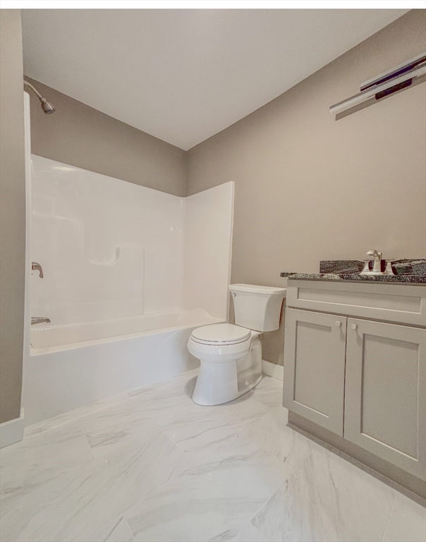 52 Richards Street Worcester, MA 01603 - Photo 19 of 20 a bathroom with a bathtub a sink a toilet and a shower