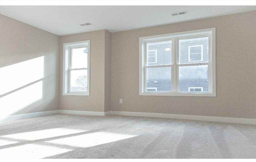 52 Richards Street Worcester, MA 01603 - Photo 3 of 20 a view of an empty room with a window