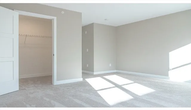 a view of an empty room and window